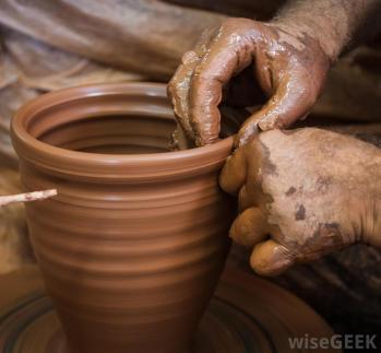 persons-hands-with-pottery